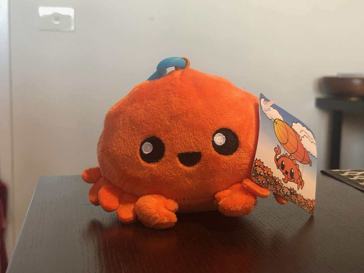 Photo of a small orange plush crab.