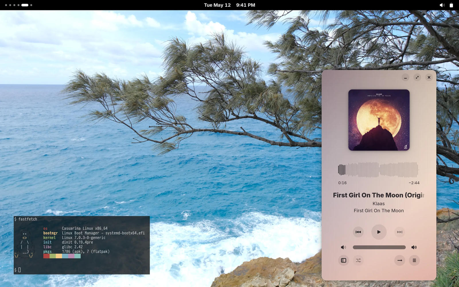 Casuarina Linux GNOME desktop with a music player open and compact fastfetch output showing OS: Casuarina Linux x86, boot manager: systemd-boot, kernel: Linux, init: dinit, libc: glibc, pkgs: apk (1786)