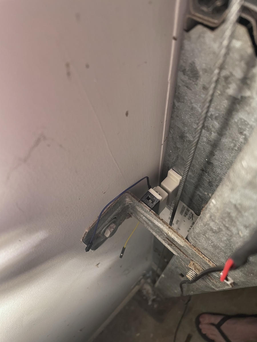 Photo of the reed switch mounted on it's 3D printed mounting block.