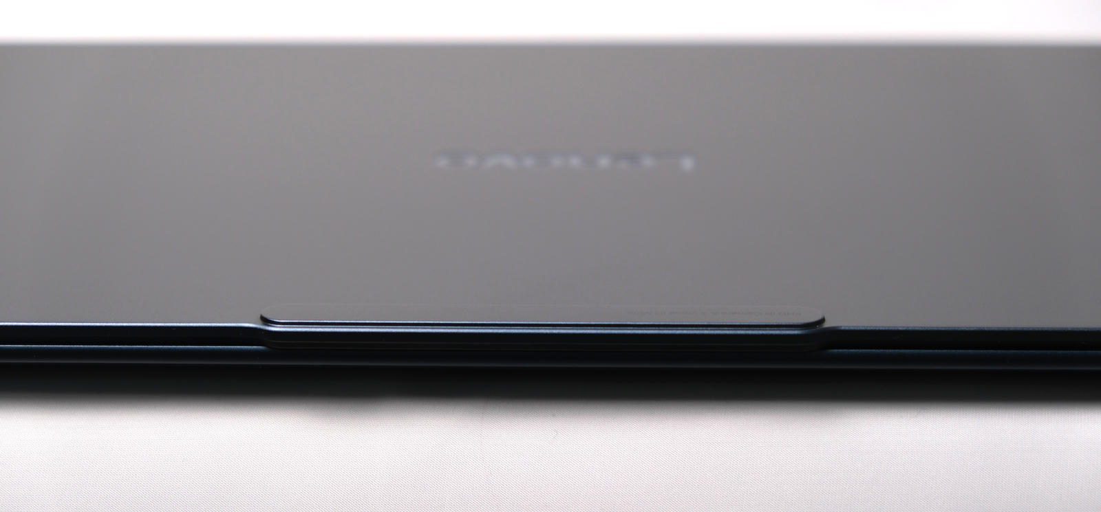 Photo of the front edge of the laptop showing the camera bump.